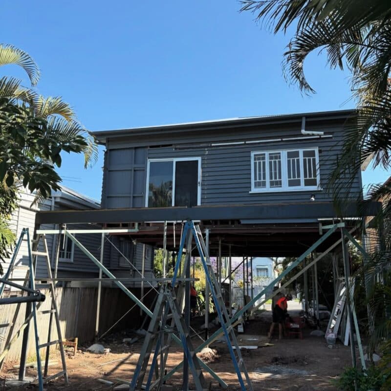 Custom home renovation in Brisbane featuring a house raise and build under construction. Jensen Constructions specialises in transforming sloping and difficult sites into functional living spaces.